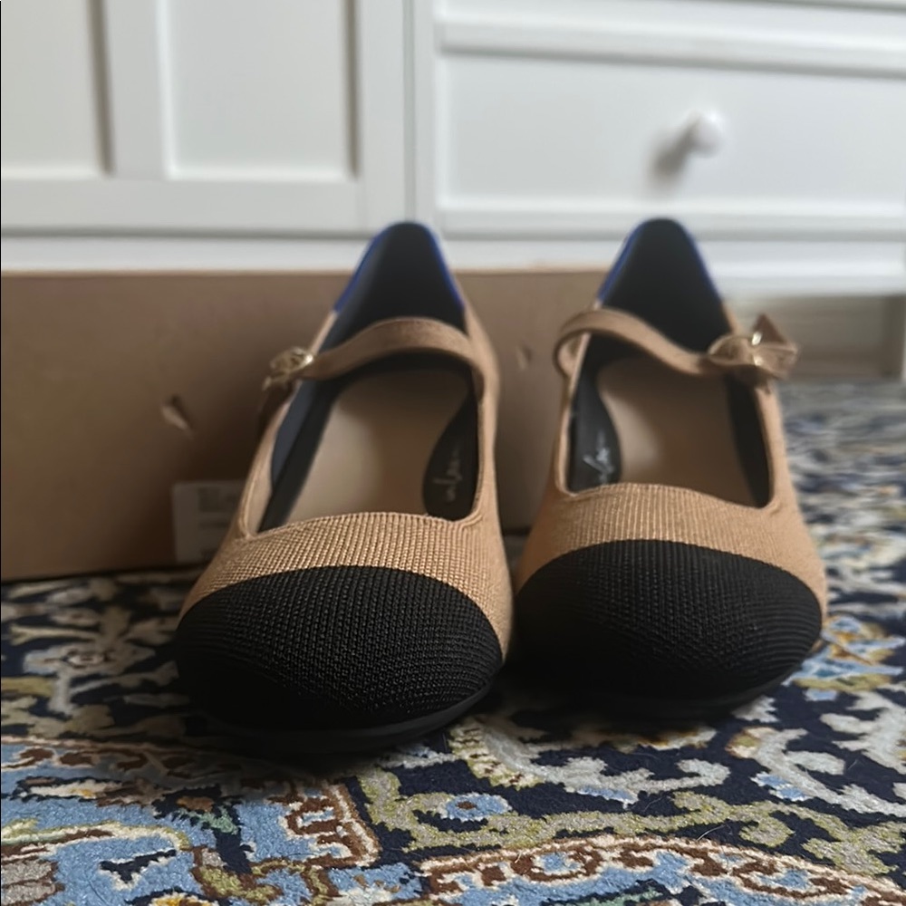 Rothy's Tan and Black Flats with Elegant Design